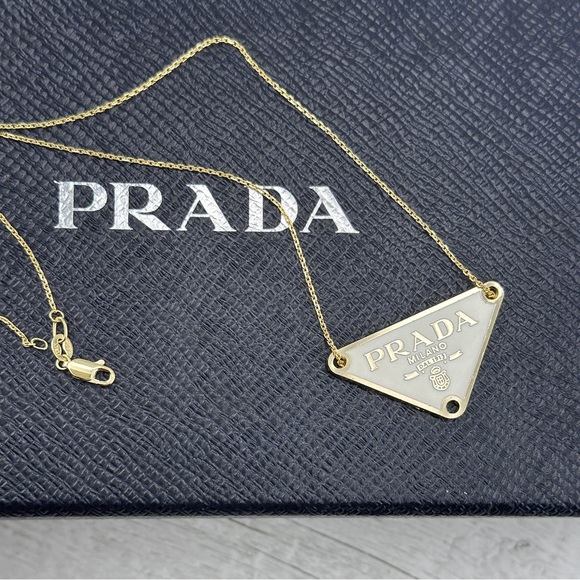 AUTHENTIC Prada charm on gold chain. White. - Picture 1 of 7